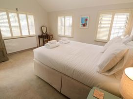 A bedroom with a bed and a mirror at 21 Alverton Street Penzance