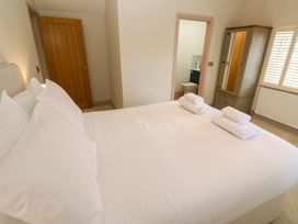 A bedroom with a bed and wardrobe at 21 Alverton Street in Penzance