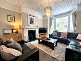 A living room with a sofa and coffee table at Royal Victoria House in Scarborough