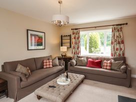 A living room with sofas and a coffee table at 21 Eskdaleside Sleights
