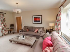 A living room with a sofa and coffee table at 21 Eskdaleside Sleights
