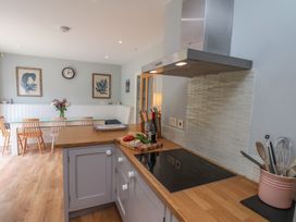 A kitchen with a countertop and stove at 21 Eskdaleside in Sleights
