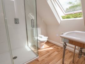 A bathroom with shower, toilet, and sink at 21 Eskdaleside Sleights
