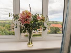 A vase of flowers on a window sill at 21 Eskdaleside Sleights