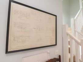A blueprint displayed on the wall near a staircase at 21 Eskdaleside Sleights