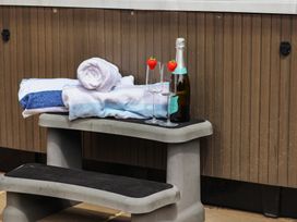 A bench with towels, champagne, and glasses at 21 Eskdaleside Sleights