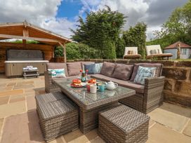An outdoor seating area with a sofa and coffee table at 21 Eskdaleside Sleights