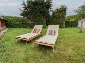 Two sun loungers on grass in a garden at 21 Eskdaleside Sleights