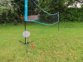 A badminton net with rackets on a grass area at 21 Eskdaleside Sleights