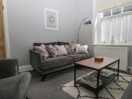 A living room with a sofa and coffee table at Number Thirty-Nine in Ulverston