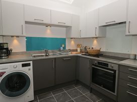 A kitchen with cabinets and appliances at Number Thirty-Nine Ulverston