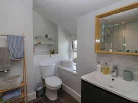A bathroom with a toilet, sink, and shower at Number Thirty-Nine, Ulverston