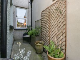 A garden area with plants and a trellis at Number Thirty-Nine in Ulverston