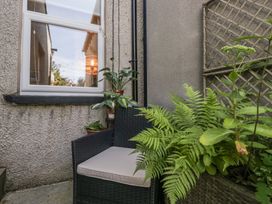 A chair and plants in an outdoor space at Number Thirty-Nine in Ulverston