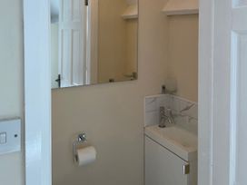 A bathroom with a sink and a mirror at Willow Nook in Glaisdale near Lealholm