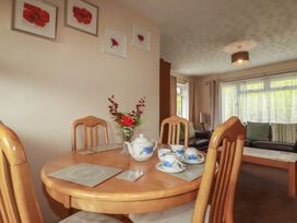 A dining room with a table set for tea at Underlanes in Boscastle