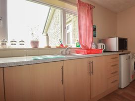 A kitchen with sink and appliances at Underlanes in Boscastle
