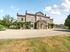 A house with windows and an entrance at Milton Manor in Milton On Stour