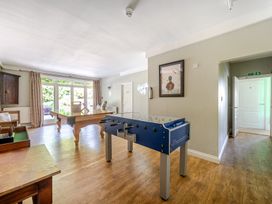 A game room with a foosball table and pool table at Milton Manor in Milton On Stour