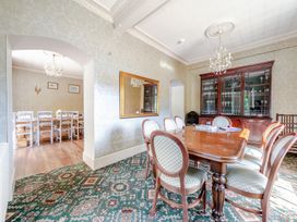 A dining room with a table and chairs in Milton Manor Milton On Stour