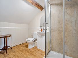 A bathroom with a sink and toilet at Milton Manor in Milton On Stour
