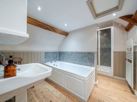 A bathroom with a bathtub and shower at Milton Manor in Milton On Stour