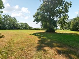 An outdoor area with trees and grass at Milton Manor in Milton On Stour