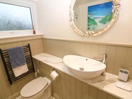 A bathroom with a sink and toilet at The Poop Deck in Coverack