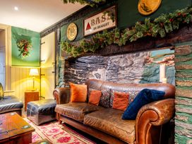 A snug area with a sofa and decorative items at The Boars Head Pub in Bishop's Castle