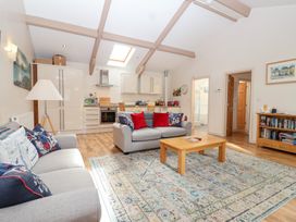 A living room with a sofa and coffee table at Tregona Buckland Monachorum near Yelverton