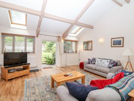 A living room with a television and sofa at Tregona Buckland Monachorum near Yelverton