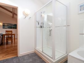 A bathroom with a shower and toilet at Tregona Buckland Monachorum near Yelverton