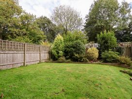 A garden with grass and trees at Tregona in Buckland Monachorum near Yelverton