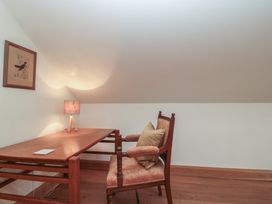 A study with a desk and chair at Bramble Cottage in Somerton