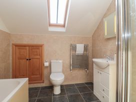 A bathroom with a shower and sink at Bramble Cottage in Somerton