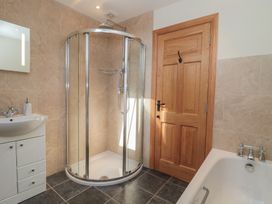 A bathroom with a shower and a sink at Bramble Cottage in Somerton