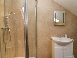 A bathroom with a shower and sink at Badger Cottage in Lydford-On-Fosse