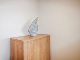 A cabinet with a decorative object at 7 Ocean's Edge Thurlestone