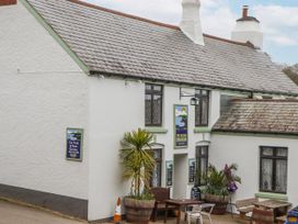An outdoor pub with a sign at The Green Dragon in Stoke Fleming