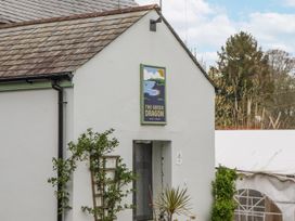A building with a sign reading The Green Dragon at Yew Tree Cottage Stoke Fleming