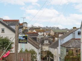 A view of buildings and the Green Dragon sign at Yew Tree Cottage Stoke Fleming