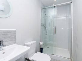 A bathroom with a sink, shower, and toilet at Crabtree Cottage in Suffield near Scalby