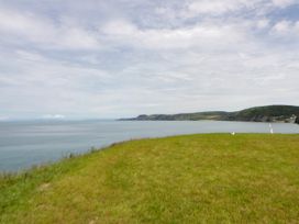 A view of the sea from a grassy area at Clifftop Carriage in Aberporth, Ceredigion