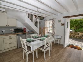 A dining area with a table and chairs at Middle Cottage in Newport, Pembrokeshire
