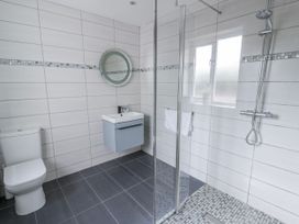 A bathroom with shower and sink at Y Felin in Cardigan, Ceredigion