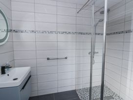 A bathroom with shower and sink at Y Felin Cardigan, Ceredigion