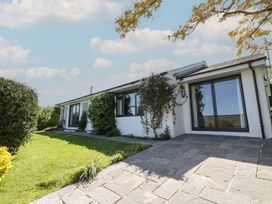 An exterior view of a house with landscaped garden at Dolwylan, Newport, Pembrokeshire