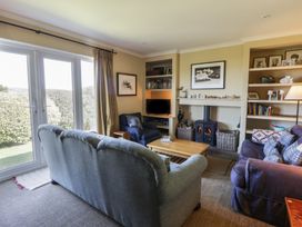 A living room with a coffee table and sofa at Dolwylan in Newport, Pembrokeshire