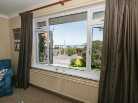 A living room with a view of the sea at Dolwylan Newport, Pembrokeshire