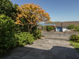 A view from a property featuring a tree and pavement at Dolwylan Newport, Pembrokeshire